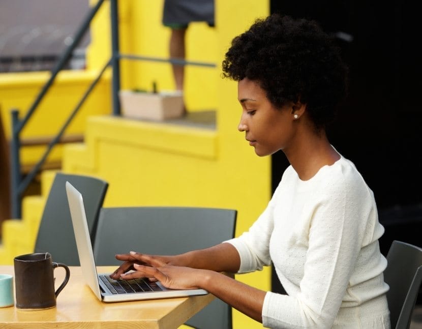attractive young woman using laptop outside P9RLFGU@2x 830x647 1